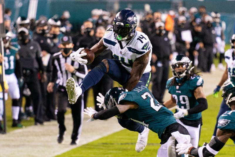 Seattle Seahawks wide receiver DK Metcalf (14) attempts to leap over the tackle of Philadelphia Eagles cornerback Darius Slay (24)