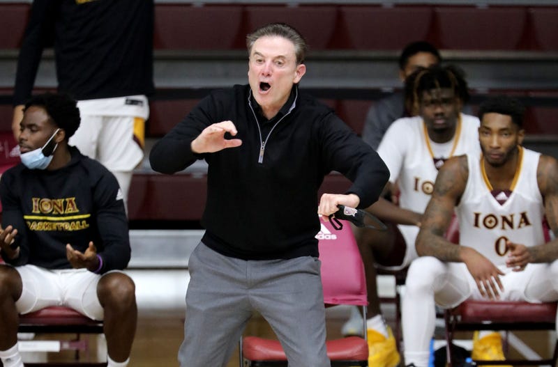 Iona head coach Rick Pitino instructs his players near the bench.
