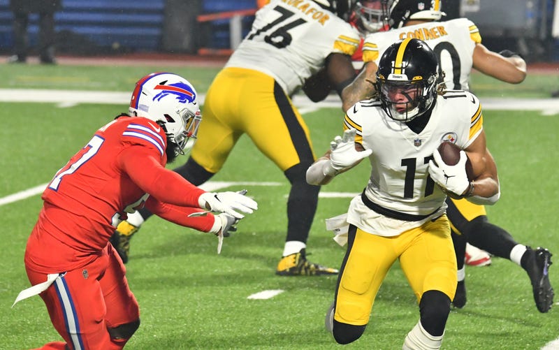 Chase Claypool (11) tries to avoid a tackle by Buffalo Bills defensive end Mario Addison