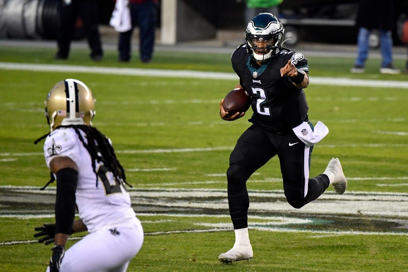 Eagles' Jalen Hurts (2) carries the ball against the Saints Sunday, Dec. 13, 2020, in Philadelphia.