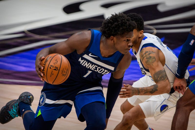 Anthony Edwards drives to the hoop against the Mavericks.