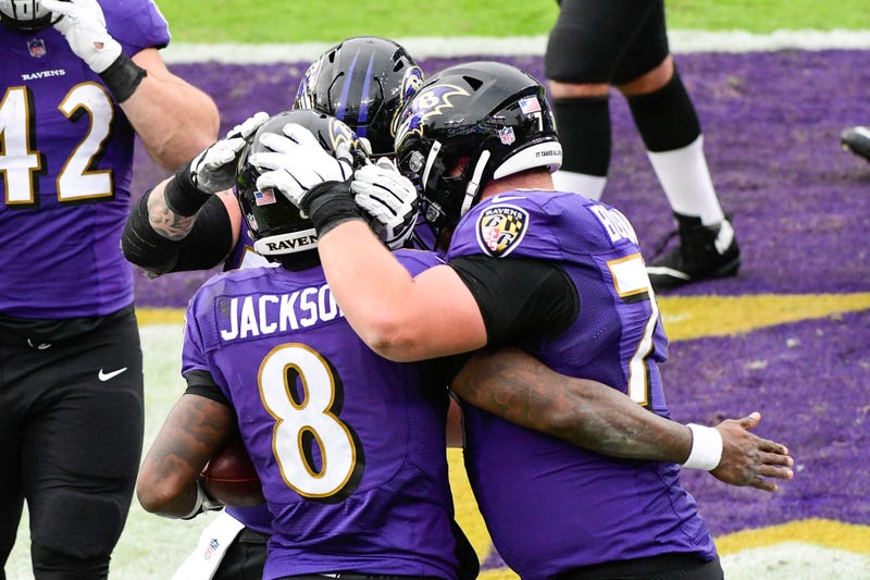 Lamar Jackson and his Ravens teammates celebrate a TD during the Ravens demolition of the Jaguars on Sunday.