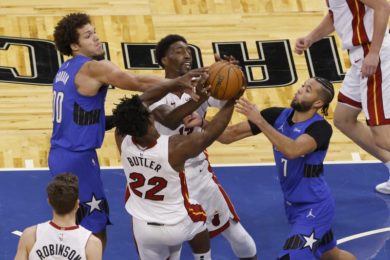 Aaron Gordon and Michael Carter-Williams battle for the ball with Bam Adebayo and Jimmy Butler