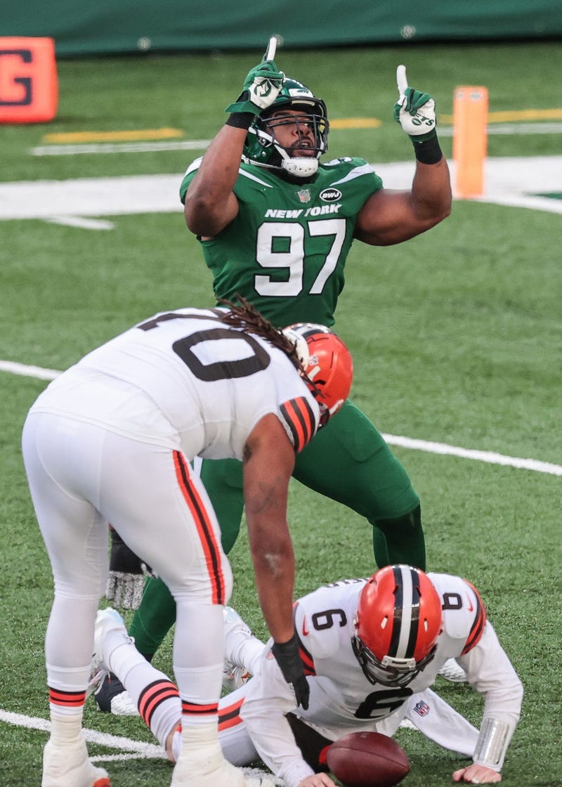 New York Jets defensive end Nathan Shepherd (97) celebrates a sack on Cleveland Browns quarterback Baker Mayfield (6) during the second half at MetLife Stadium.