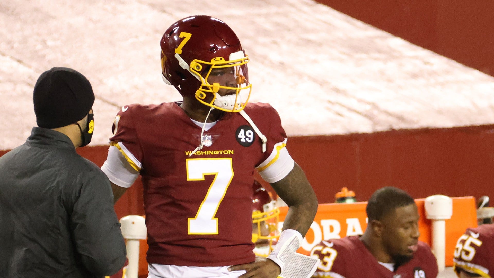 Why did Dwayne Haskins run onto the field to talk to Taylor Heinicke?