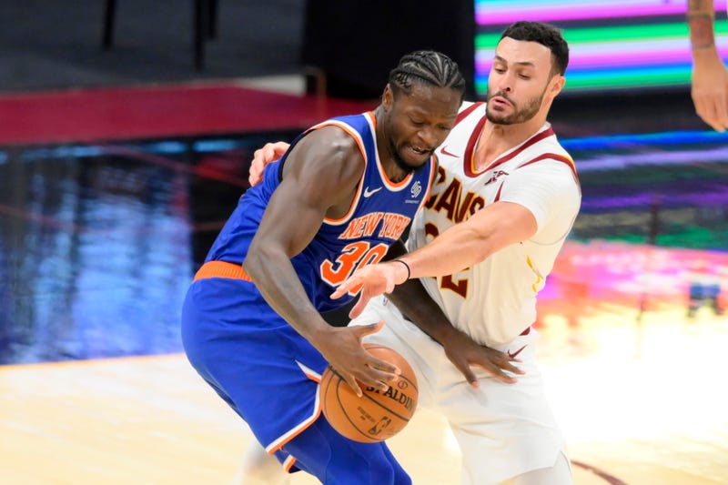 Dec 29, 2020; Cleveland, Ohio, USA; Cleveland Cavaliers forward Larry Nance Jr. (22) defends New York Knicks forward Julius Randle (30) in the third quarter at Rocket Mortgage FieldHouse.