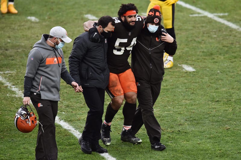 Cleveland Browns defensive end Olivier Vernon (54) is helped off the field during the second half against the Pittsburgh Steelers at FirstEnergy Stadium.