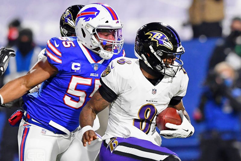 Lamar Jackson is pursued by Bills LB Jerry Hughes during the Ravens 17-3 loss to the Bills.