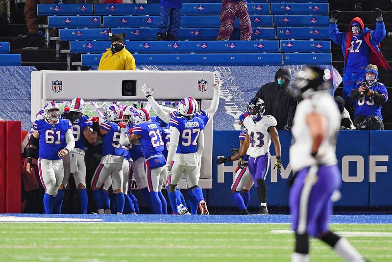The Bills celebrate after running back a Lamar Jackson interception for a TD.