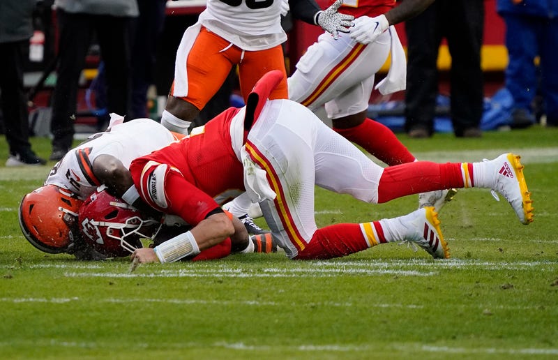 Chiefs QB Patrick Mahomes is tackled and injured by Browns LB Mack Wilson during Sunday's AFC Divisional Playoff game.