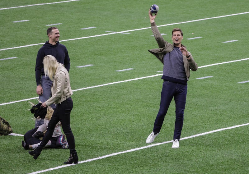 Drew Brees and Tom Brady on the field after the game