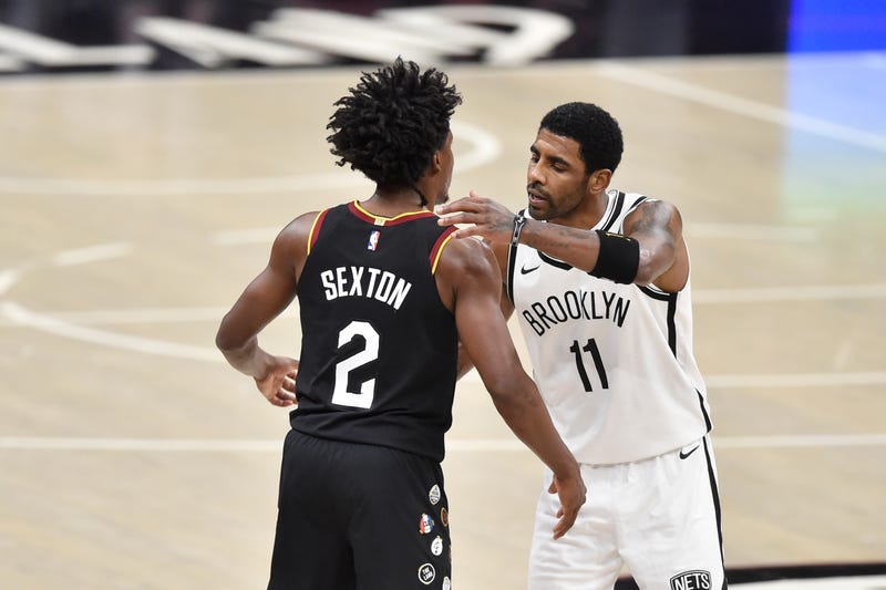 Jan 20, 2021; Cleveland, Ohio, USA; Cleveland Cavaliers guard Collin Sexton (2) and Brooklyn Nets guard Kyrie Irving (11) after the Cavliers double overtime win at Rocket Mortgage FieldHouse.
