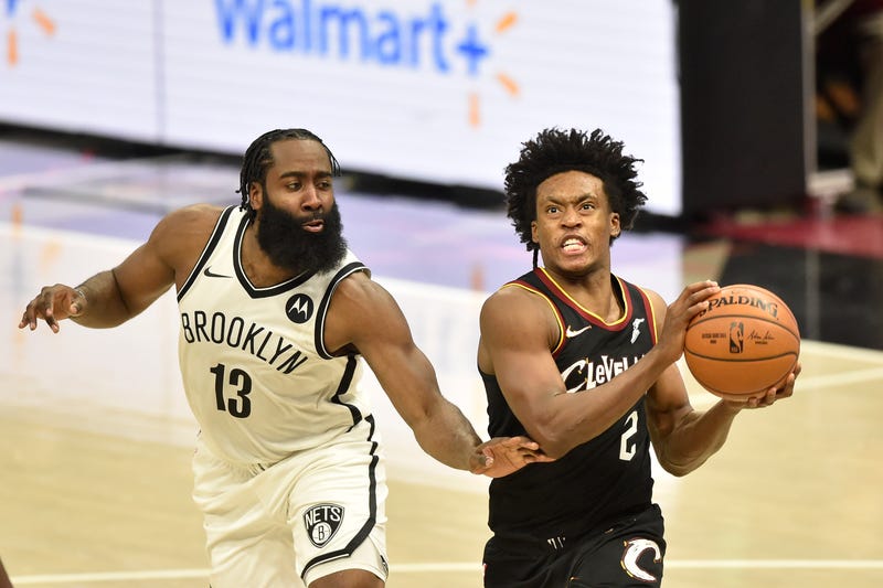 Jan 20, 2021; Cleveland, Ohio, USA; Cleveland Cavaliers guard Collin Sexton (2) drives against Brooklyn Nets guard James Harden (13) in the second overtime at Rocket Mortgage FieldHouse. 