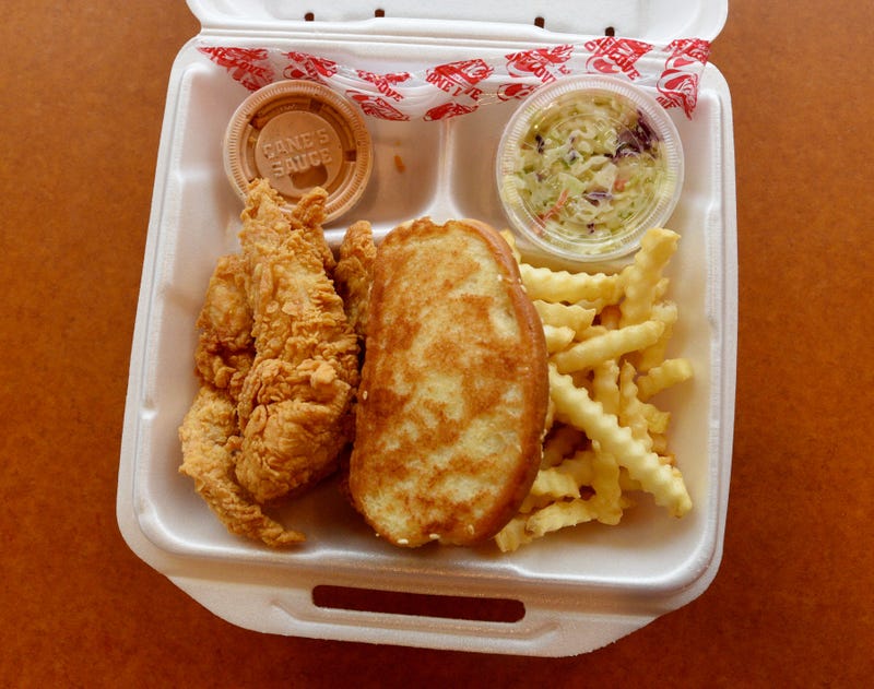 Chicken fingers with toast and French fries