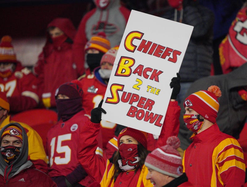 A Kansas City Chiefs fan holds up a 'Back-2-The-Super-Bowl' CBS sign during the AFC Championship Game.