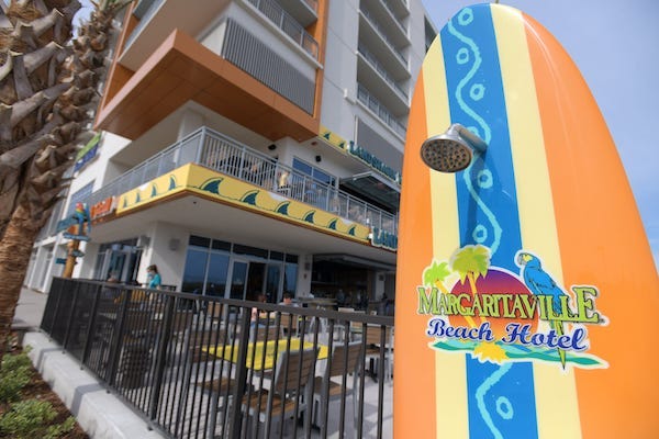 Showers built into surfboards along the boardwalk behind the Margaritaville Beach Hotel