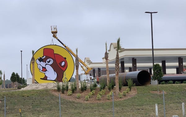 Construction workers get ready to erect the big sign for a Buc-ee's gas station/convienece store