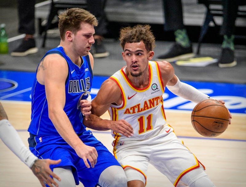 Feb 10, 2021; Dallas, Texas, USA; Dallas Mavericks guard Luka Doncic (77) defends against Atlanta Hawks guard Trae Young (11) during the first quarter at the American Airlines Center. 