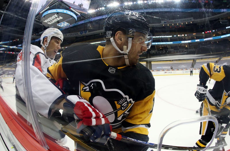 Zach Aston-Reese against the glass
