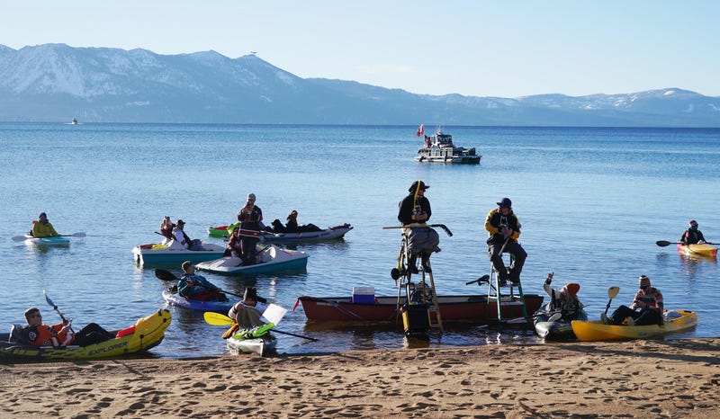 Fans watch from the lake