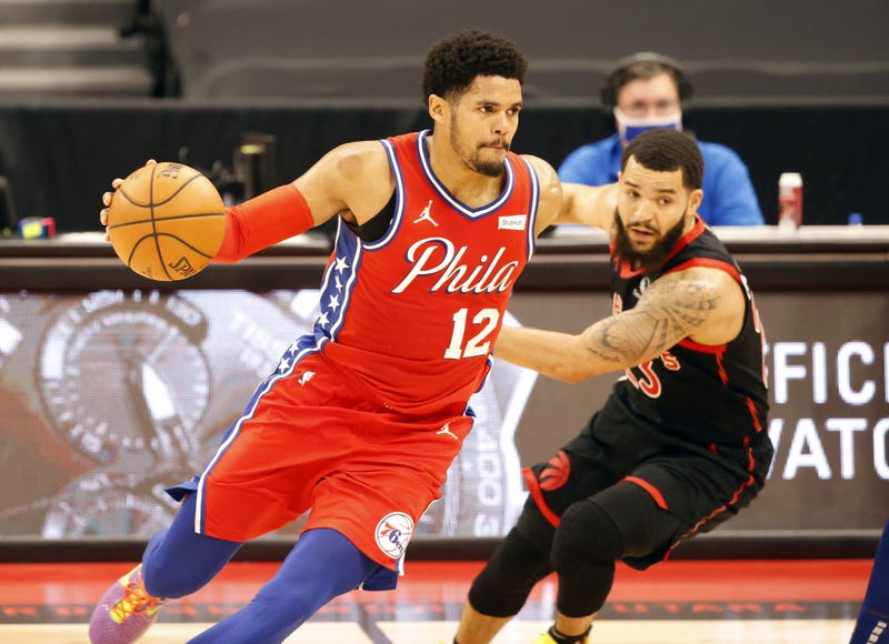 Philadelphia 76ers forward Tobias Harris (12) drives to the basket as Toronto Raptors guard Fred VanVleet (23) defends during the second quarter at Amalie Arena.