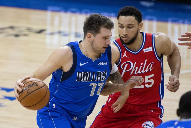 Dallas Mavericks guard Luka Doncic (77) drives against Philadelphia 76ers guard Ben Simmons (25) during the first quarter at Wells Fargo Center.