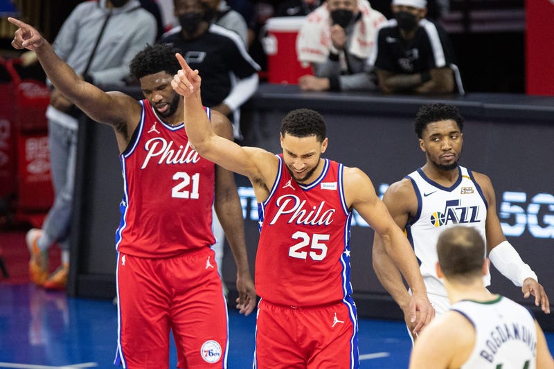 Philadelphia 76ers guard Ben Simmons (25) and center Joel Embiid (21) reacts in front of Utah Jazz guard Donovan Mitchell (45) after a turnover during overtime at Wells Fargo Center.