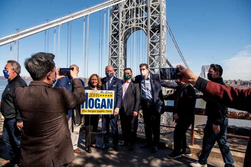 Bergen County Clerk John Hogan announces his reelection campaign in Fort Lee, a nod to his opponent's role in the Bridgegate saga. People gather around John Hogan to take pictures in front of a view of the George Washington Bridge in Fort Lee on Friday March 12, 2021