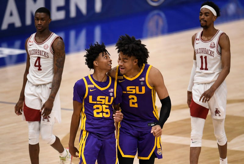 LSU guard Eric Gaines (25) and LSU forward Trendon Watford (2) celebrate their 78 to 71 win against Arkansas in the SEC Men's Basketball Tournament semifinal game at Bridgestone Arena Saturday, March 13, 2021 in Nashville, Tenn. Nas Sec Lsu Ark 045