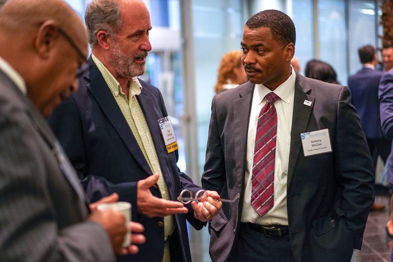 Former Shining Light Honoree Dan Carmody, of Eastern Market Corporation, talks with Anthony McCree, of George Johnson & Company, during the 12th Annual Detroit Free Press' Shining Light Regional Cooperation Awards reception and breakfast at the Ford Conference and Event Center in Dearborn on Oct. 4, 2018
