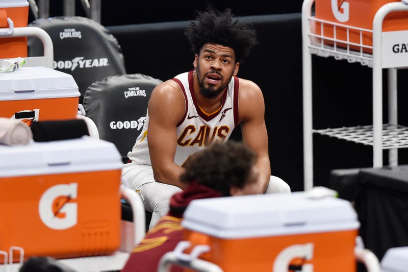 Mar 22, 2021; Cleveland, Ohio, USA; Cleveland Cavaliers guard Quinn Cook (4) reacts on the bench in the fourth quarter against the Sacramento Kings at Rocket Mortgage FieldHouse.