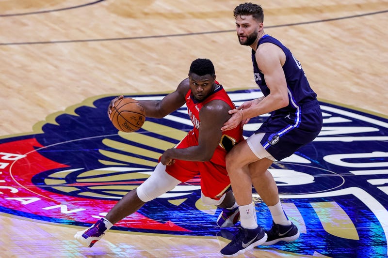 New Orleans, Louisiana, USA; New Orleans Pelicans forward Zion Williamson (1) dribbles around Dallas Mavericks forward Maxi Kleber (42) during the second half at the Smoothie King Center.