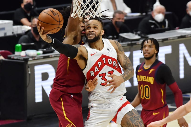 Apr 10, 2021; Cleveland, Ohio, USA; Toronto Raptors guard Gary Trent Jr. (33) drives to the basket against Cleveland Cavaliers guard Collin Sexton (2) during the fourth quarter at Rocket Mortgage FieldHouse. 