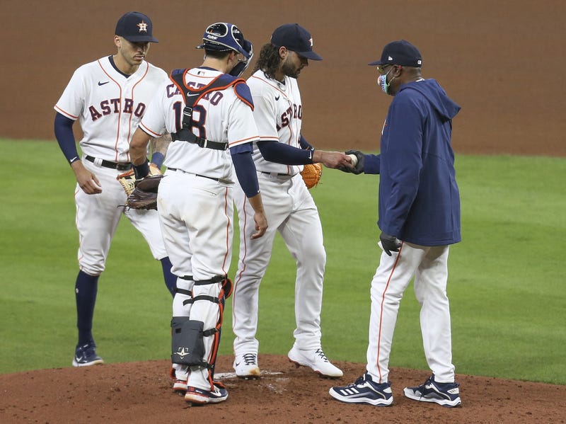 Houston Astros starting pitcher Lance McCullers Jr. (43) is pulled by Houston Astros manager Dusty Baker Jr. (12) against the Detroit Tigers in the fourth inning at Minute Maid Park.
