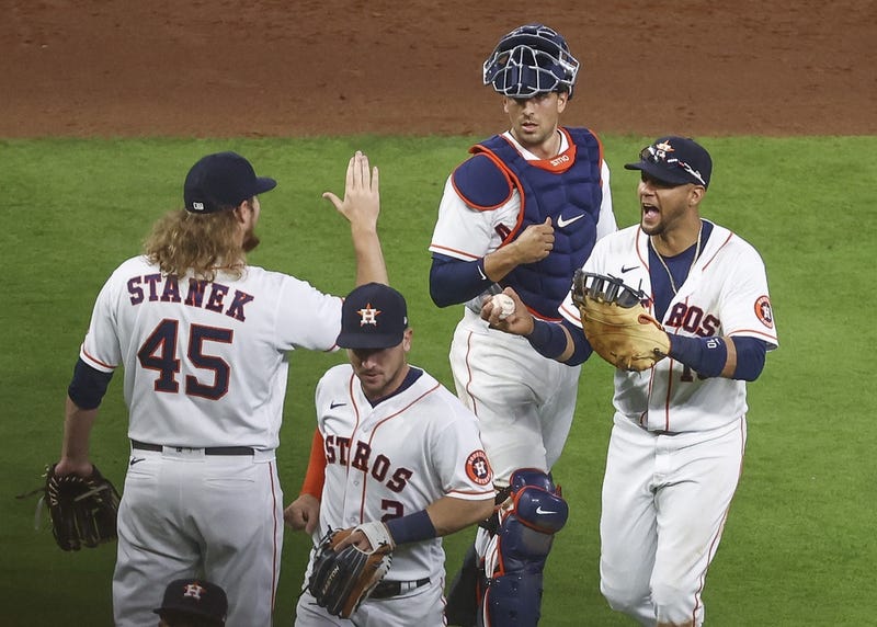Houston Astros first baseman Yuli Gurriel (10) celebrates with relief pitcher Ryne Stanek (45) after the Astros defeated the Seattle Mariners at Minute Maid Park.