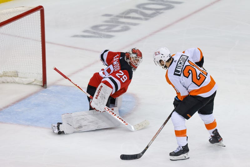 Philadelphia Flyers left wing Scott Laughton (21) scores a goal past New Jersey Devils goaltender Mackenzie Blackwood (29) during the second period at Prudential Center.