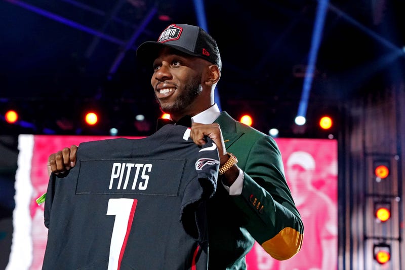Apr 29, 2021; Cleveland, Ohio, USA; Kyle Pitts (Florida) poses with a jersey after being selected by Atlanta Falcons as the number four overall pick in the first round of the 2021 NFL Draft at First Energy Stadium. Mandatory Credit: Kirby Lee-Imagn Images