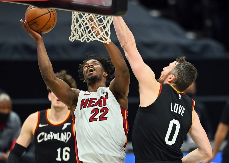 May 1, 2021; Cleveland, Ohio, USA; Miami Heat forward Jimmy Butler (22) drives to the basket against Cleveland Cavaliers forward Kevin Love (0) during the third quarter at Rocket Mortgage FieldHouse.