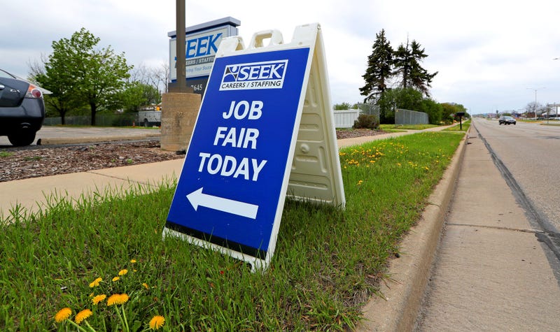 A sign promoting a job fair is seen at SEEK Careers/Staffing on North 76th Street in Milwaukee on Monday, May 3, 2021.