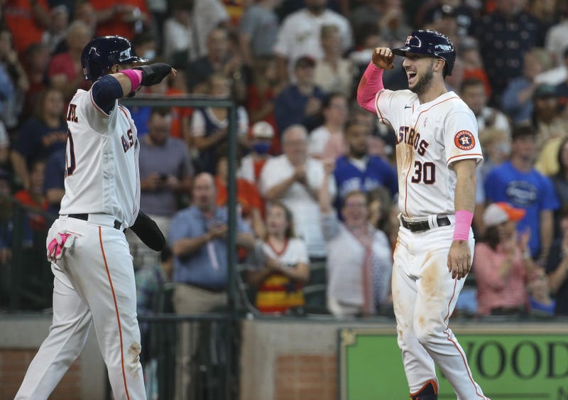 Houston Astros right fielder Kyle Tucker (30) celebrates with first baseman Yuli Gurriel (L) after hitting a home run during the fourth inning against the Toronto Blue Jays at Minute Maid Park.