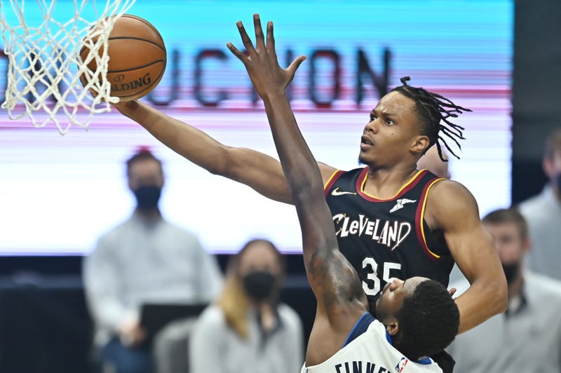May 9, 2021; Cleveland, Ohio, USA; Cleveland Cavaliers forward Isaac Okoro (35) drives to the basket against Dallas Mavericks forward Dorian Finney-Smith (10) during the first quarter at Rocket Mortgage FieldHouse. 