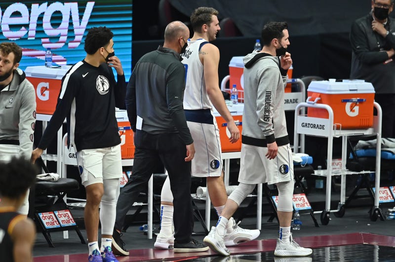 May 9, 2021; Cleveland, Ohio, USA; Dallas Mavericks guard Luka Doncic (77) is escorted off the floor after being ejected during the third quarter against the Cleveland Cavaliers at Rocket Mortgage FieldHouse. 