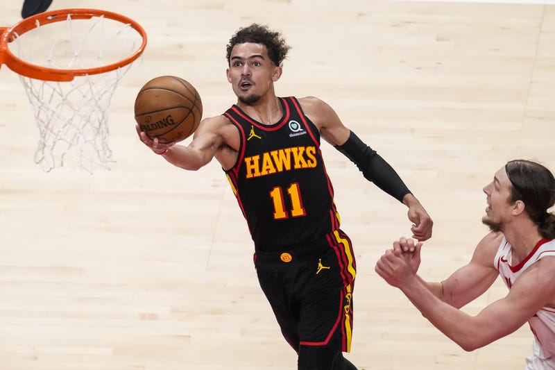 Atlanta Hawks guard Trae Young (11) goes to the basket against Houston Rockets forward Kelly Olynyk (41) during the first half at State Farm Arena.