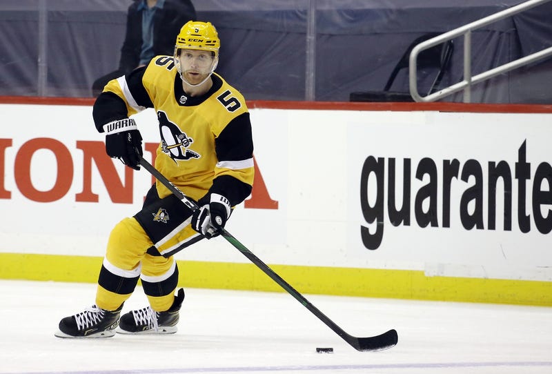 Mike Matheson with puck