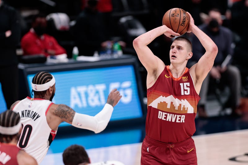 Denver Nuggets star Nikola Jokic attempts a jump shot.