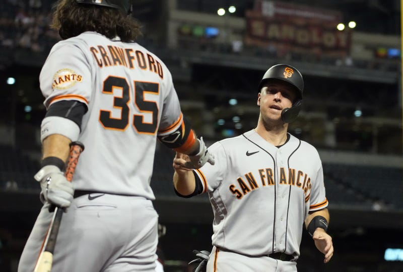 Brandon Crawford and Buster Posey slap hands