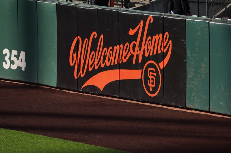 A sign welcoming fans is painted on the outfield wall as seen before the game between the San Francisco Giants and the Los Angeles Dodgers at Oracle Park.