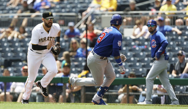 Will Craig (38) chases Chicago Cubs shortstop Javier Baez (9)
