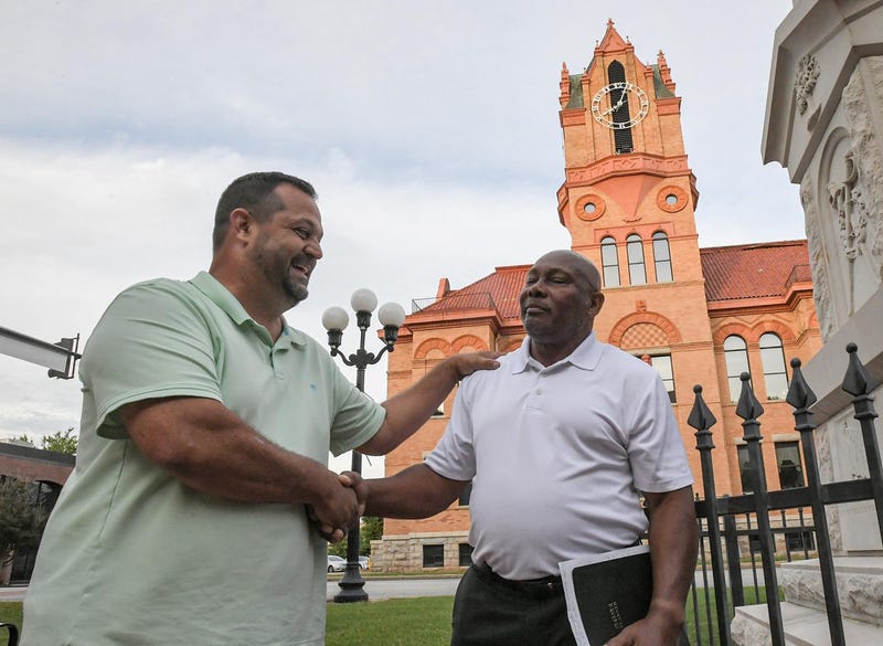 Candidate David Standard, left, concedes to Glenn Davis after votes were counted for Anderson County Council special election to fill the District 2 seat, in front of the county courthouse in Anderson.