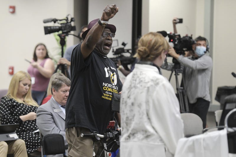 Residents speak out during a Department of Education meeting in Jacksonville, Fla.